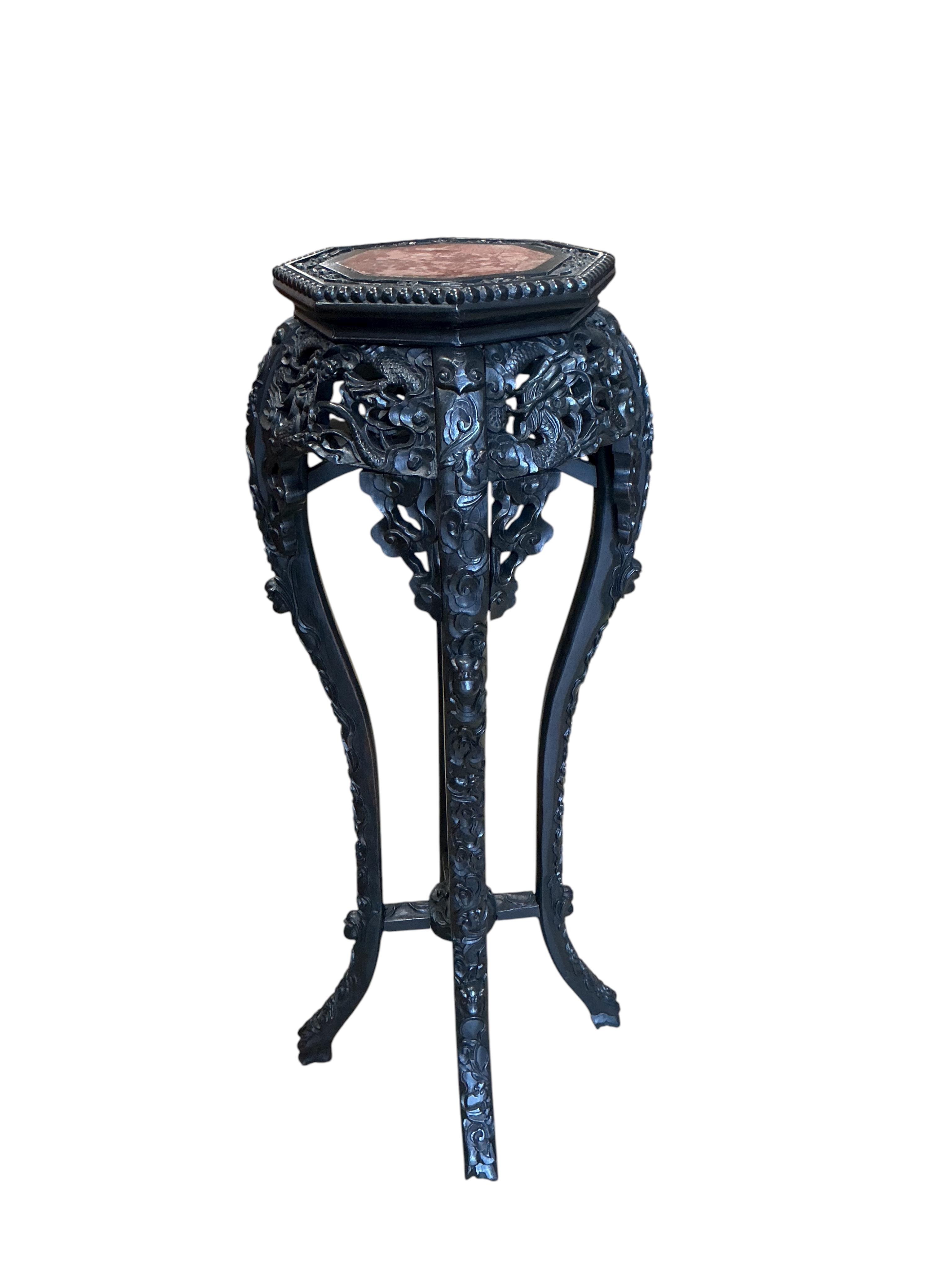 A Chinese octagonal marble topped vase stand, width 32cm, height 91cm